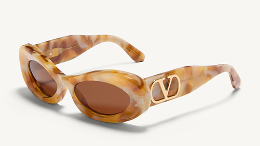 Sunglasses with tortoiseshell frame and brown lenses on a white background