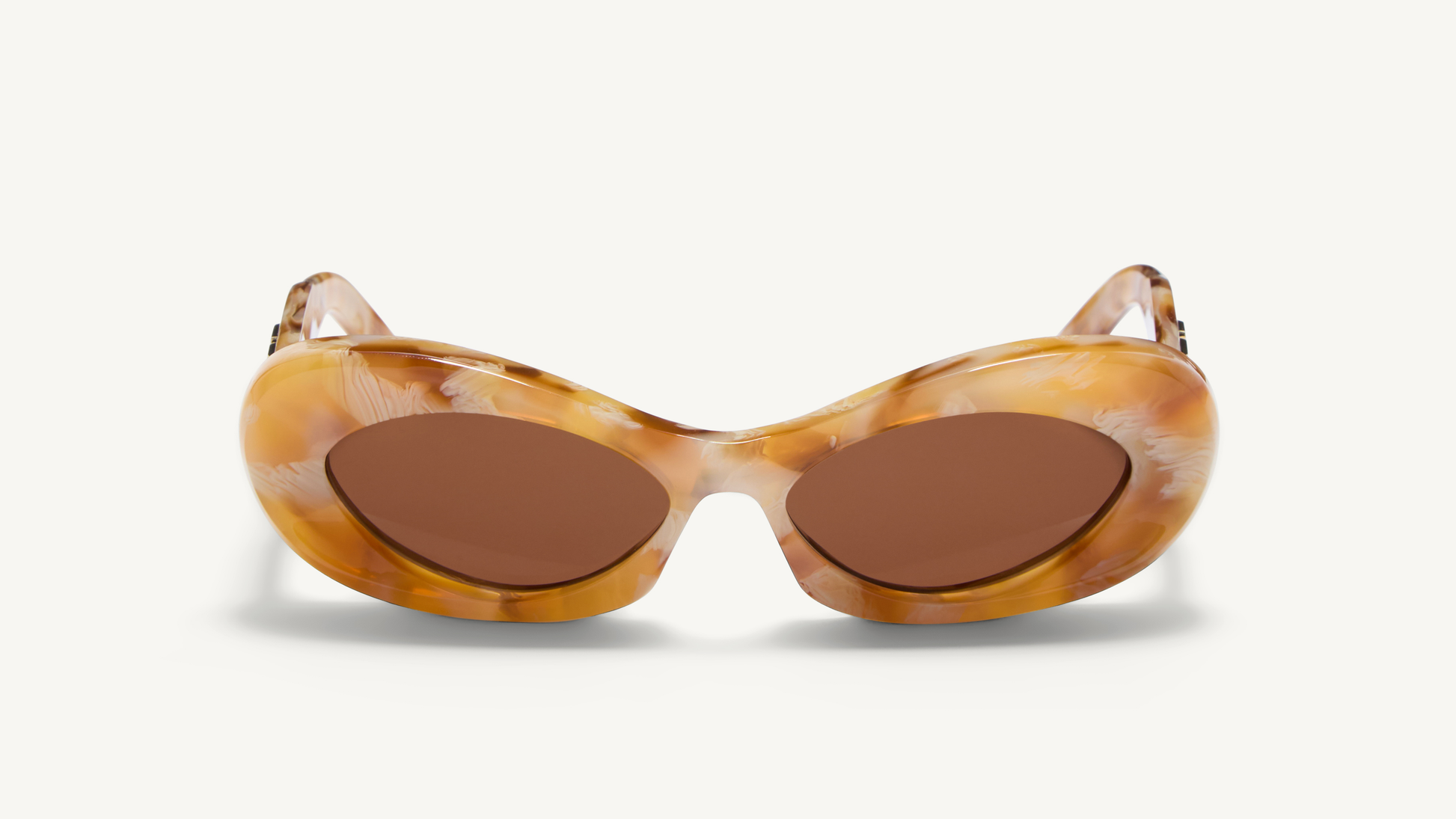 Sunglasses with tortoiseshell frame and brown lenses on a white background